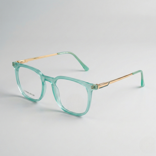 Green eyeglasses with gold accents on a light gray background